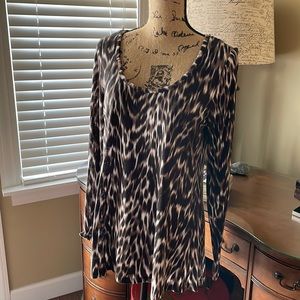 Make an entrance in this leopard & black tunic top